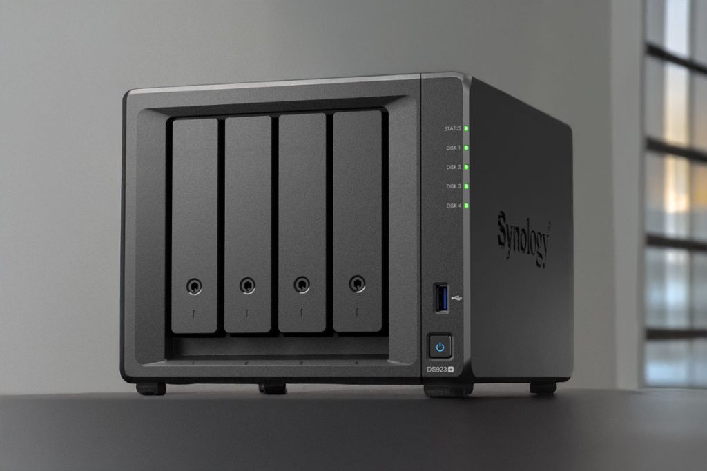 Synology DS923+ NAS system with four drive bays and status indicator lights.