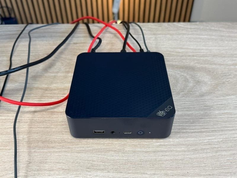 Beelink EQ14 mini computer with multiple ports for connectivity in a modern office