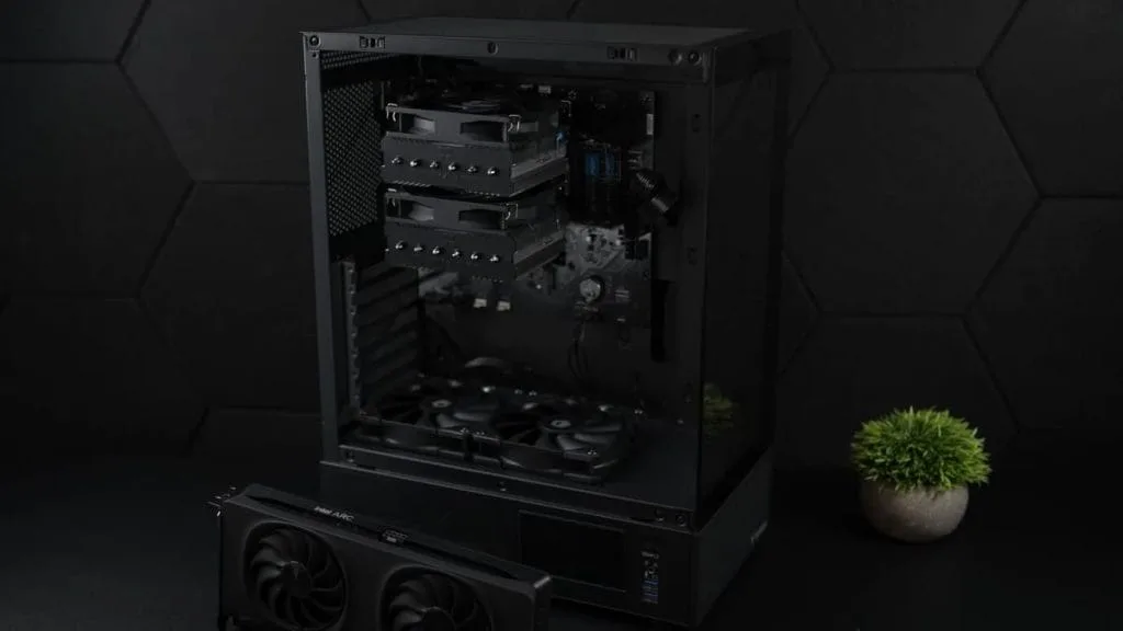 A modern gaming PC, Minisforum BD795M, with installed components and an open case revealing its internals.