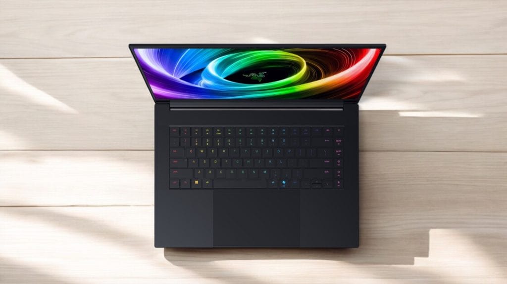 Razer Blade 16 (2025) RTX 5090. A sleek black laptop with a colorful keyboard and vibrant display, showcasing gaming features.