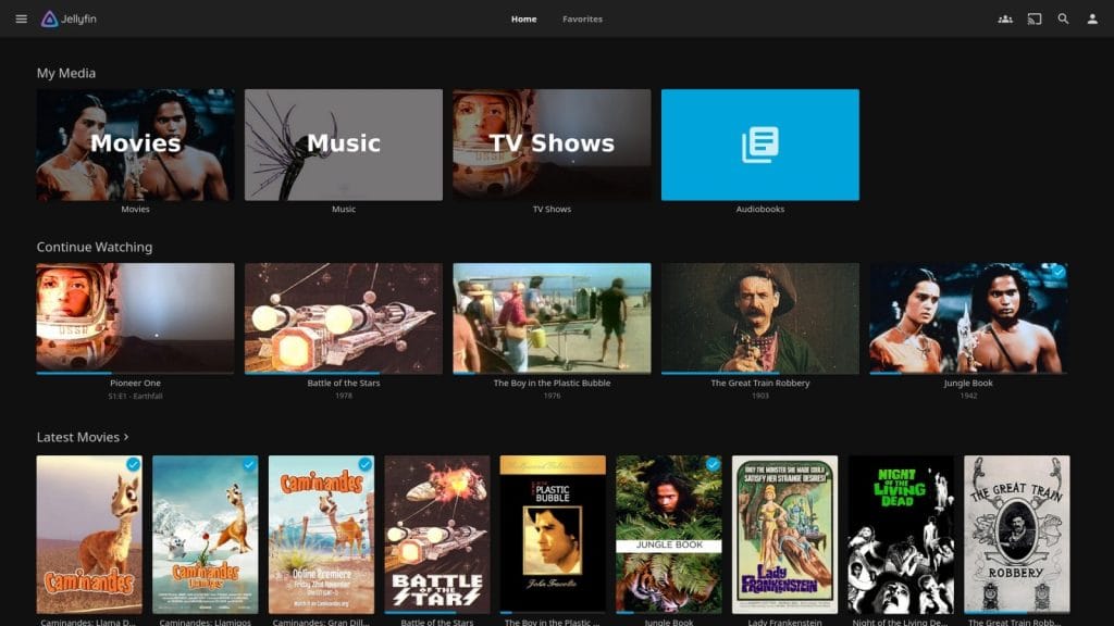 A user interface of Jellyfin with sections for Movies, Music, TV Shows, and Audiobooks, displaying various media items.