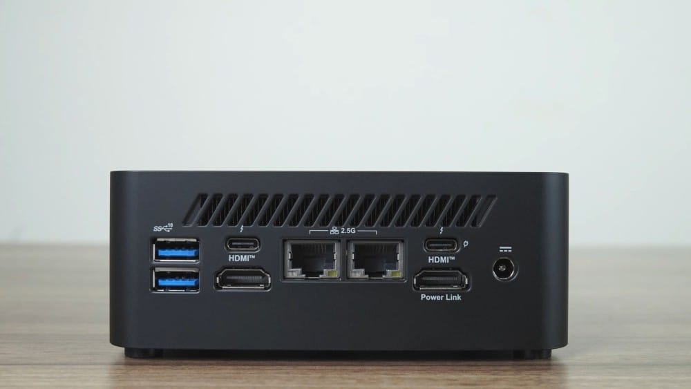 A compact mini computer with various ports including USB and HDMI, suitable for home or office use.