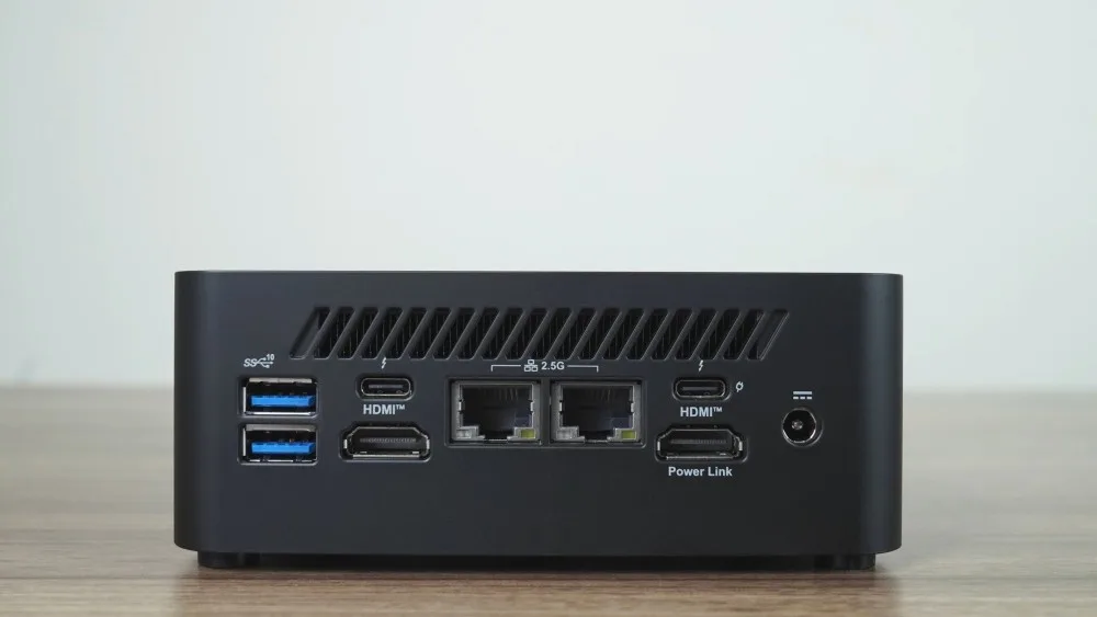 A compact mini computer with various ports including USB and HDMI, suitable for home or office use.