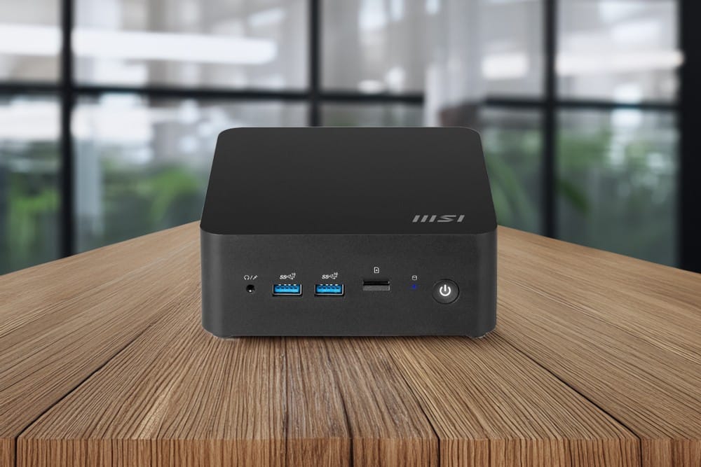 A sleek MSI compact desktop featuring USB ports on a wooden table, suitable for home or office use.