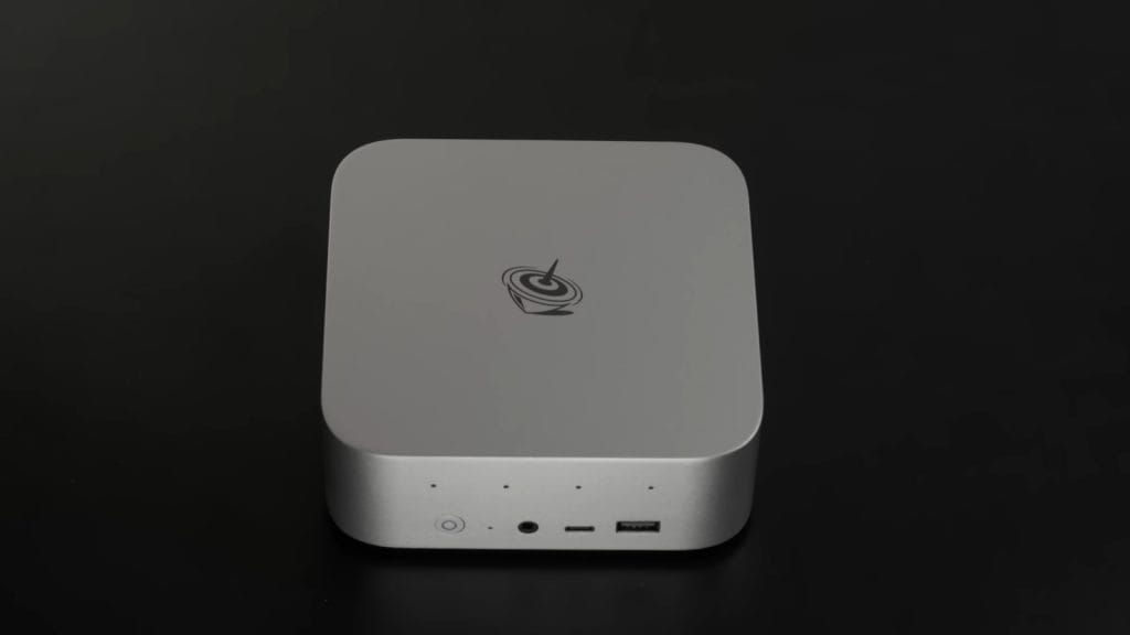 A sleek silver media device Beelink SER9 Pro with ports on the front, ideal for entertainment setups