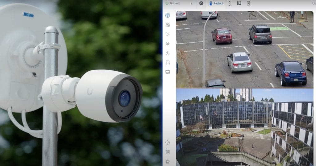 A high-definition surveillance camera mounted outdoors with a live view of street traffic and a nearby building in Portland.