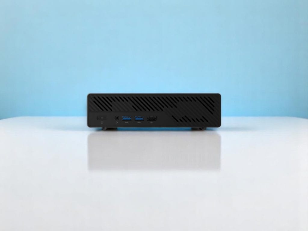 Minisforum MS-A2. Front view of a compact black mini PC with USB ports and power button on a white surface and blue background