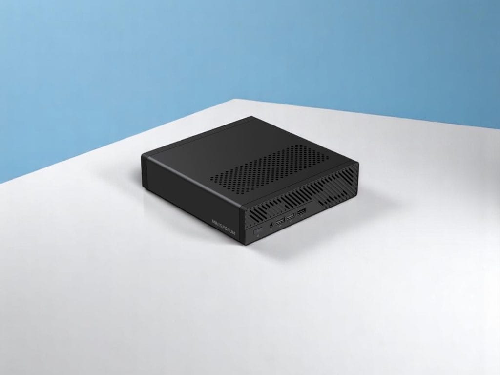 A compact black mini PC from MinisForum MS-A2 placed on a white surface with a light blue background