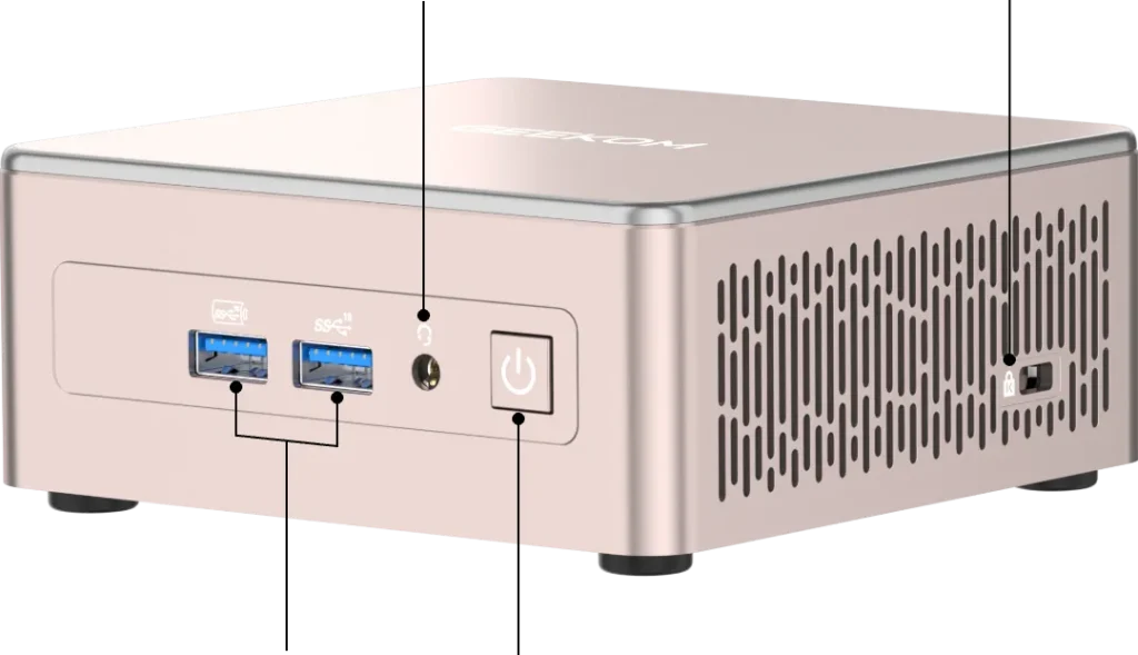 Rose gold mini PC front view with USB ports, headphone jack, power button and ventilation grill